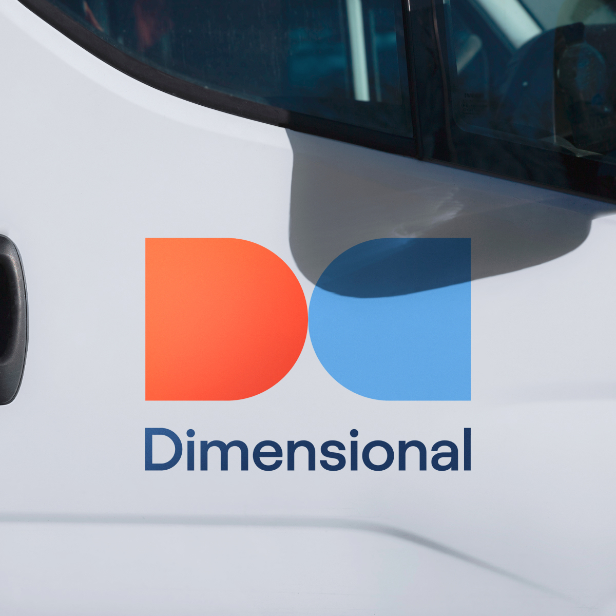 Dimensional Energy's logo applied to the door of a truck