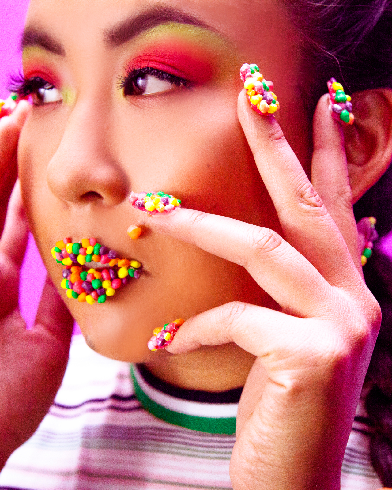 A woman wearing prototypes of Nerds x MAC collab makeup items.