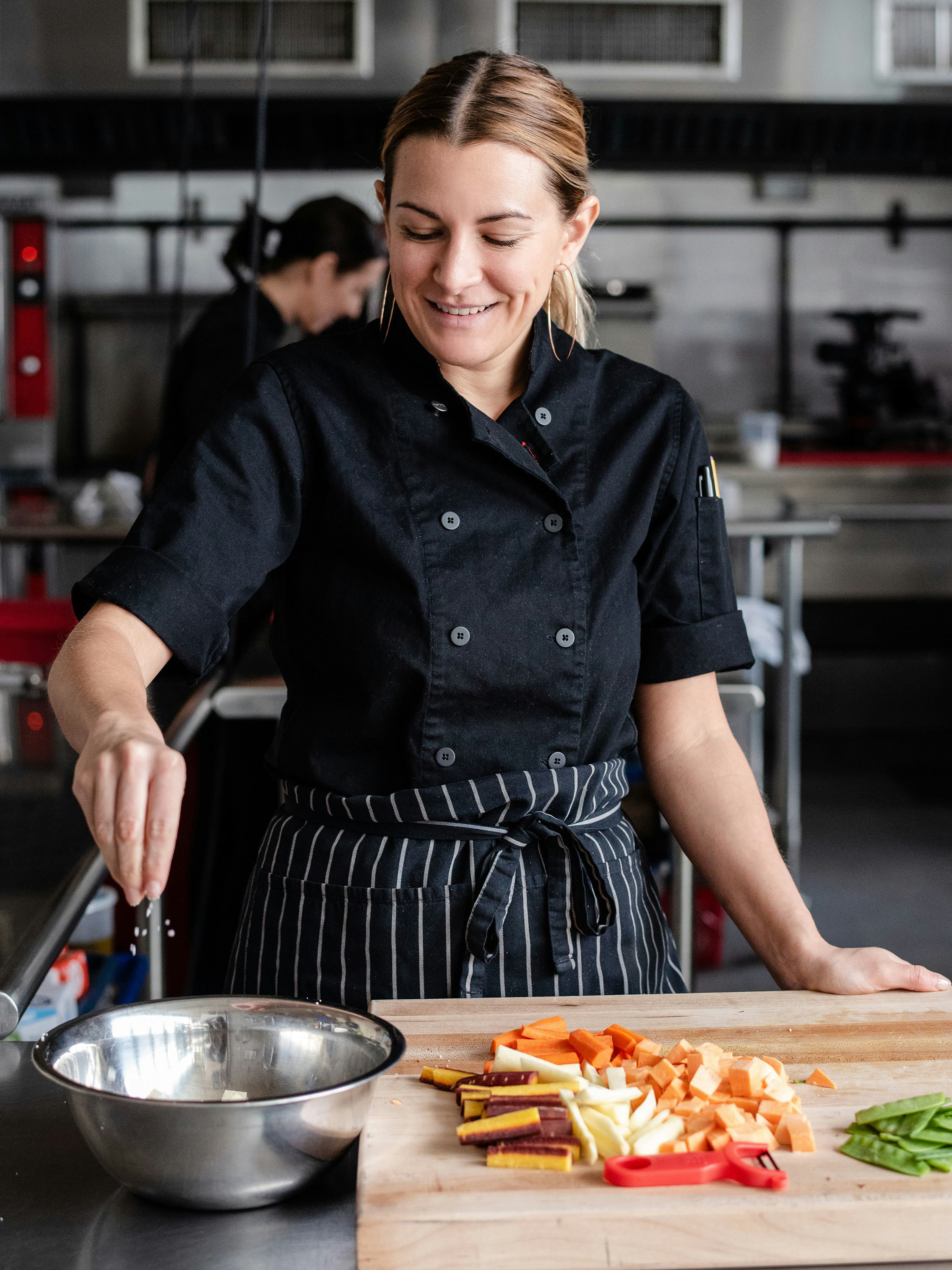 Chef Nikki from Plantable cooking in the kitchen