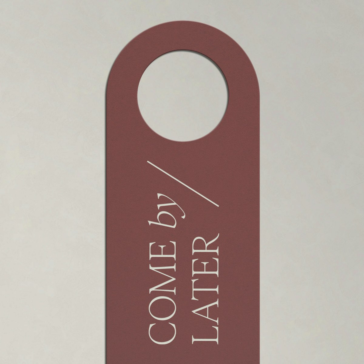 A door tag for Tempo by Hilton that says "Come by later"